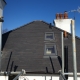 Scaffold Around the Tiled Roof with Velux Windows