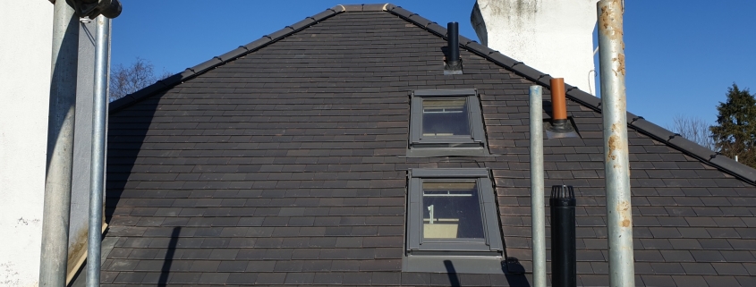 Scaffold Around the Tiled Roof with Velux Windows